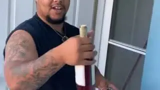 Guy shows us how to open a wine bottle without a wine opener.