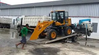 Transfer of heavy equipment by self loader truck
