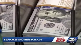 Analysis: Fed cuts key interest rate