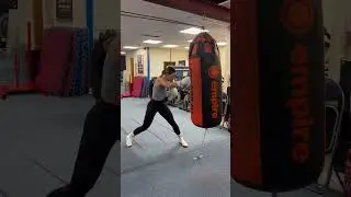 TERRI HARPER PUTS IN THE WORK ON THE HEAVY BAG IN CAMP