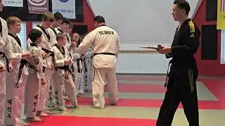 Angela, Gabriella, & Nicholas receiving Black Belt 2d Star Tip