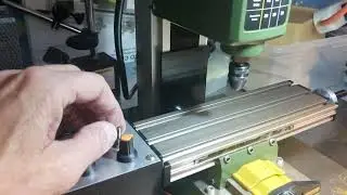Modified Proxxon Mini Mill with powered table drive.