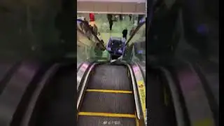 Robot falls down escalator on people