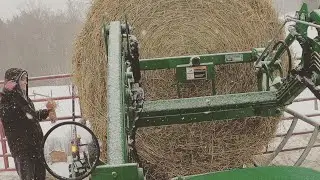 Cold blustery day feeding a bale with the 2038R