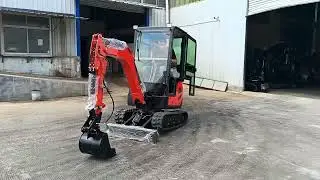Mini crawler excavator with dozer blade and crawler tracks, optional attachments