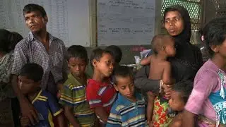 Rohingya refugees queue for food in Bangladesh
