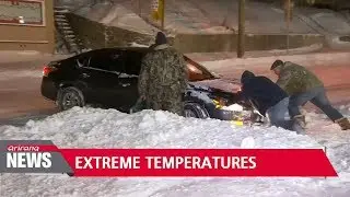 North America in deep freeze as Australia nearly breaks heat record
