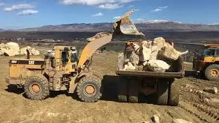 Caterpillar 988F Wheel Loader Loading Rocks At Komatsu Dumpers - Kyvos Ateve