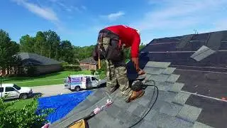 A.J. Wells Roofing Contractors Jacksonville Florida roof replacement installing shingles