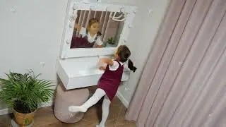 Young girl exploring movement playful, Caucasian girl engaging in rhythmic activity at home, Small