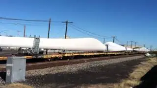 A lot of wind power propeller blades on a train