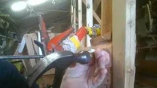 Nailing the hood end on number 8 starboard , using a brass drift or punch. Damage limitation.