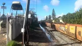 BNSF 102 leads a baretable train towards the ports at Sepulveda Blvd 