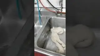 guy hitting bucket with big ol dough thing