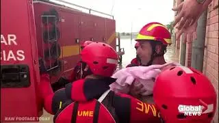 Spain Floods: Police rescue baby and stranded flood victims as thousands evacuate to safety