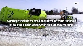 Driver hospitalized after garbage truck hit by train near Whitneyville