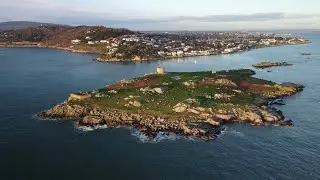 Dalkey island (as Gaeilge, Deilginis = 'thorn island') on a sunny St Stephen's day [4k drone]