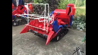 crawler type harvester with driver seat on wet field