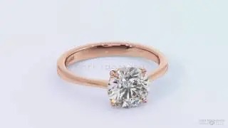 Rose gold solitaire round diamond set in a four claw basket