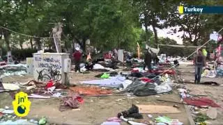 Istanbul's Gezi Park protesters vow to stay put: Taksim Square quiet after night of heavy clashes