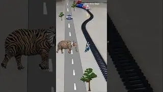 Elephant Tiger is following the lady near the railway crossing and the train is approaching fast 🐘 🐅