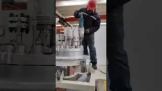 The bolting of flange on pilot reactor head