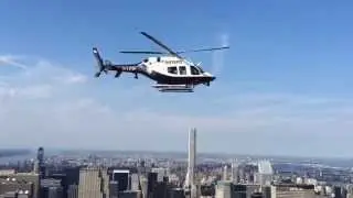 Top of the Empire State Building : NYPD helicopter waving at us !