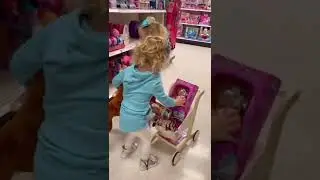 Twin baby girls shopping at Target