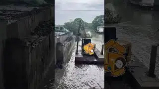 Combination of excavator and floating boat river