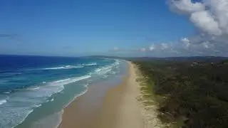 Drone flying over Tallow Beach in Byron Bay, New South Wales, Australia