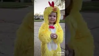 Cute baby in chicken costume