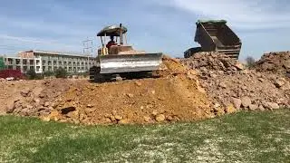 Performs work well with teamwork of machinery komatsu bulldozer in dump truck Cambo 