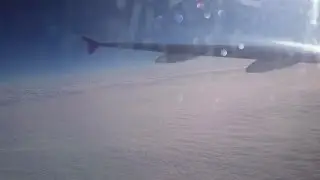 Amazing cloudscape view from aircraft window. Sun shining in endless blue sky. Stock Footage