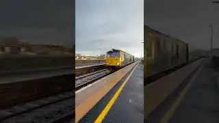 Empty coaching stock Caledonian sleeper class 73 passing Carnoustie