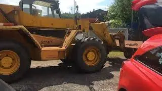 Moving two unearthed rail trucks from the compound.
