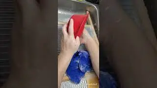 Handwashing a muscle shirt using a washboard