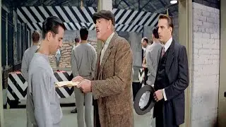 An older cop is provoking a new recruit about his race, not realizing who he's messing with