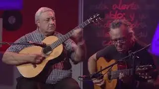 Los guitarristas Julio Cobelli y Toto M&eacute;ndez interpretan 