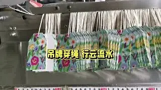 Hangtag knot tying machine 