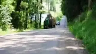 John Deere 730 pulls 3 hay wagons
