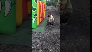 Mason getting blown away by the jumping castle