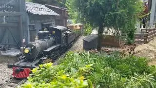 Narrow Gauge #12  picks up a load of Case farm equipment and brings it up to the 