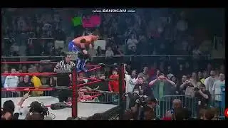 Aj Styles splashes Kip James through table