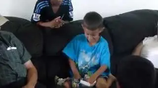 Robu bringing out a small gift for Jason on his 8th birthday 06/25/2015
