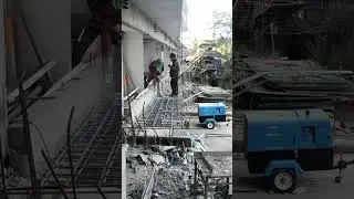 DEMOLITION OF EXCESS CONCRETE USING PORTABLE AIR COMPRESSOR.
