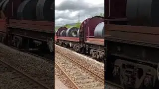 Ex Ews DB cargo class 66 passes Pontyclun with steel at speed