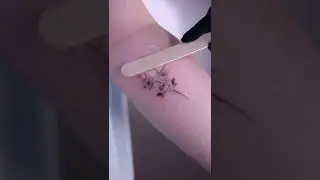 Stunning dainty floral tattoo done at Atelier Eva Tattoo Studio in Brooklyn.
