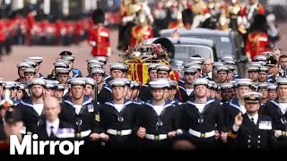 Queen's coffin procession walks through London after leaving Westminster Abbey
