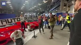 Extinction Rebellion activists infiltrate Paris Motor Show to glue themselves to Ferrari supercars