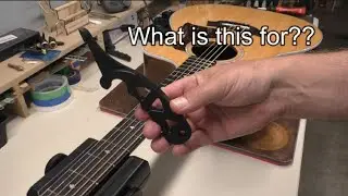 What is this tool?  A String Stretcher, of course...